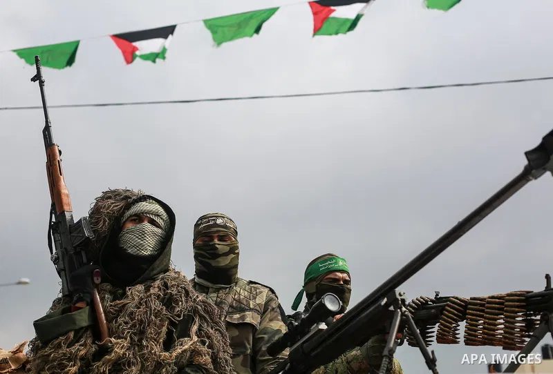 Members of the Ezzedine al-Qassam Brigades, the military wing of the Palestinian Islamist movement Hamas, attend a memorial in Rafah in the southern Gaza Strip on January 31, 2017, for Mohamed Zouari, a 49-year-old Tunis...