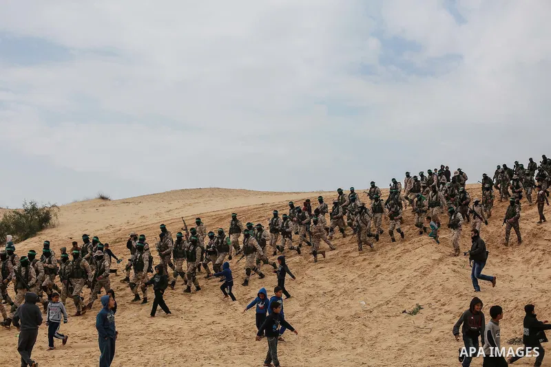 Members of the Ezzedine al-Qassam Brigades, the military wing of the Palestinian Islamist movement Hamas, attend a memorial in Rafah in the southern Gaza Strip on January 31, 2017, for Mohamed Zouari, a 49-year-old Tunis...