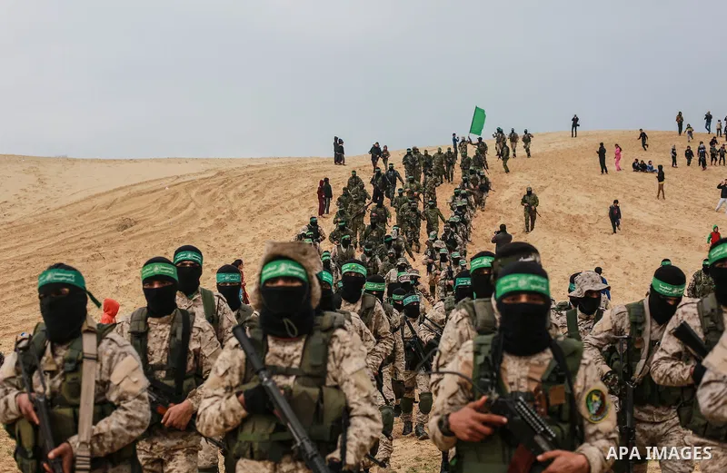 Members of the Ezzedine al-Qassam Brigades, the military wing of the Palestinian Islamist movement Hamas, attend a memorial in Rafah in the southern Gaza Strip on January 31, 2017, for Mohamed Zouari, a 49-year-old Tunis...