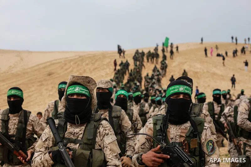 Members of the Ezzedine al-Qassam Brigades, the military wing of the Palestinian Islamist movement Hamas, attend a memorial in Rafah in the southern Gaza Strip on January 31, 2017, for Mohamed Zouari, a 49-year-old Tunis...