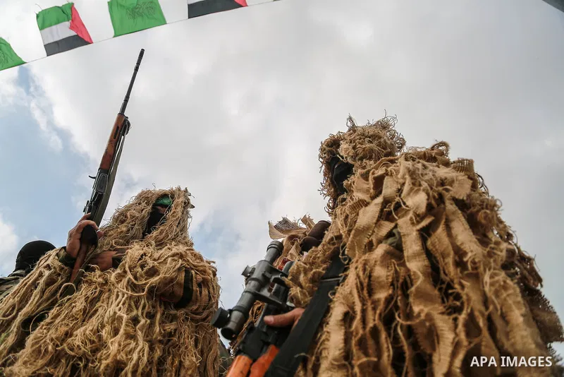 Members of the Ezzedine al-Qassam Brigades, the military wing of the Palestinian Islamist movement Hamas, attend a memorial in Rafah in the southern Gaza Strip on January 31, 2017, for Mohamed Zouari, a 49-year-old Tunis...