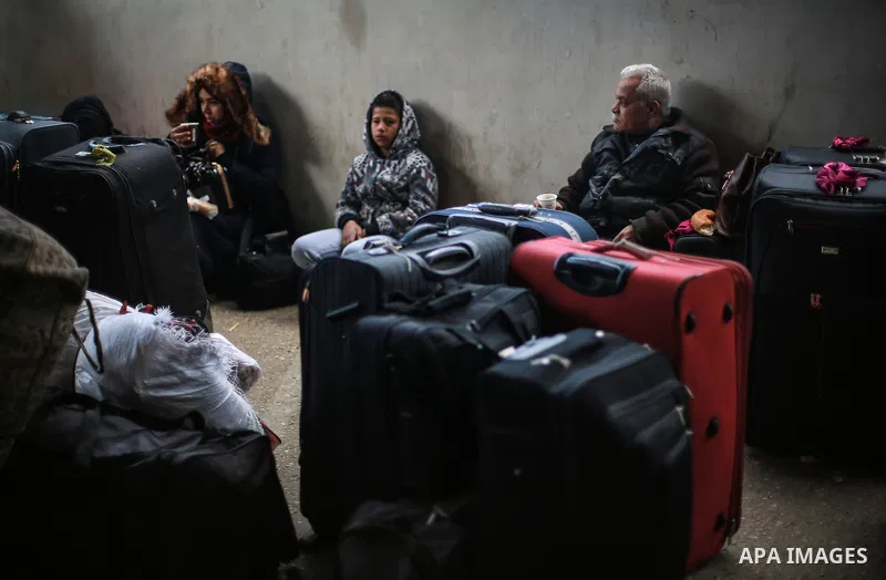 Palestinians wait for travel permits to cross into Egypt through the Rafah border crossing after it was opened by Egyptian authorities for humanitarian cases, in Rafah in the southern Gaza Strip, on January 31, 2017. Pho...