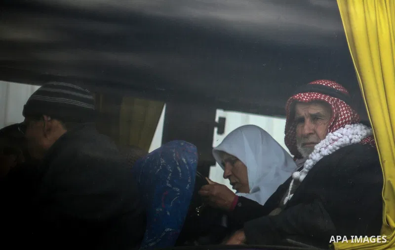 Palestinians wait for travel permits to cross into Egypt through the Rafah border crossing after it was opened by Egyptian authorities for humanitarian cases, in Rafah in the southern Gaza Strip, on January 31, 2017. Pho...