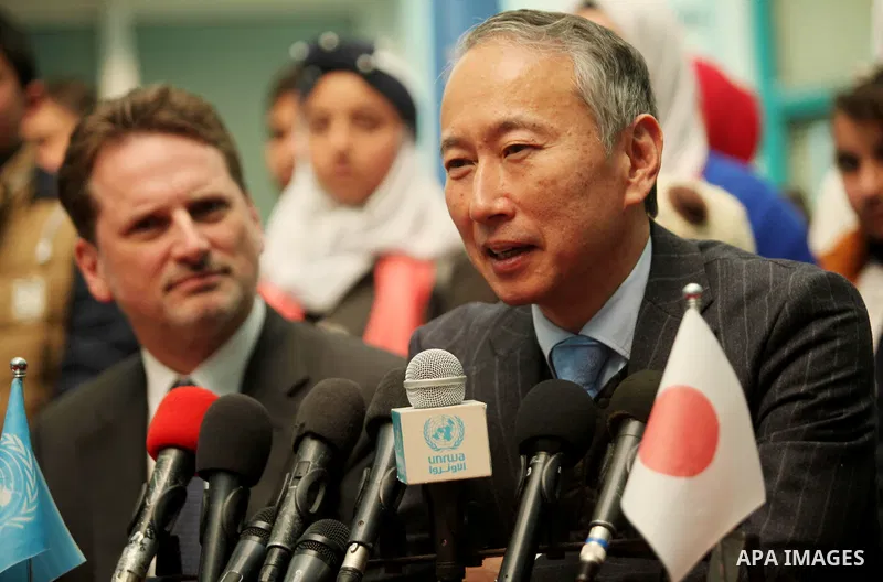 Japanese Ambassador to Palestine, Takeshi Okubo speaks during a joint press conference with Commissioner-General of the UN Relief and Works Agency (UNRWA) Pierre Krahenbuhl, at the headquarters United Nations Relief and...