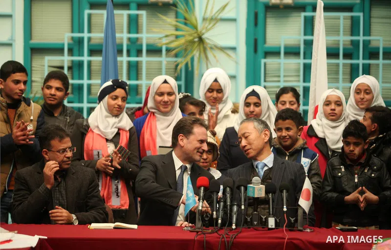 Japanese Ambassador to Palestine, Takeshi Okubo, and Commissioner-General of the UN Relief and Works Agency (UNRWA) Pierre Krahenbuhl, attend a joint press conference at the headquarters United Nations Relief and Works A...