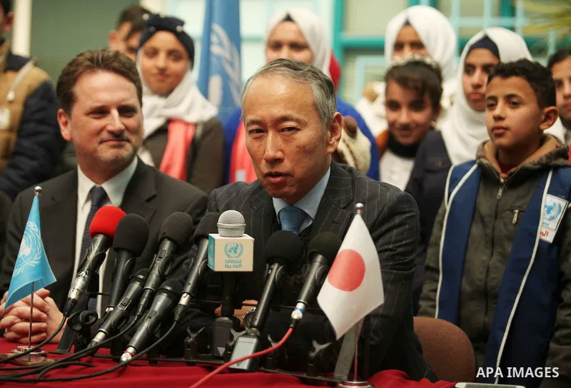Japanese Ambassador to Palestine, Takeshi Okubo speaks during a joint press conference with Commissioner-General of the UN Relief and Works Agency (UNRWA) Pierre Krahenbuhl, at the headquarters United Nations Relief and...