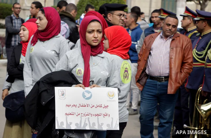 Egyptian women hold placards during a protest to show solidarity with displaced women in Arab countries, at Cairo University, marking the Arab women's day in the Egyptian capital Cairo on Feb. 01, 2017. Photo by Amr Saye...