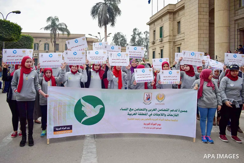 Egyptian women hold placards during a protest to show solidarity with displaced women in Arab countries, at Cairo University, marking the Arab women's day in the Egyptian capital Cairo on Feb. 01, 2017. Photo by Amr Saye...