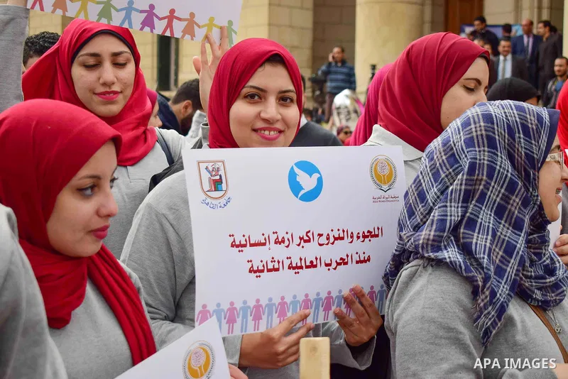 Egyptian women hold placards during a protest to show solidarity with displaced women in Arab countries, at Cairo University, marking the Arab women's day in the Egyptian capital Cairo on Feb. 01, 2017. Photo by Amr Saye...