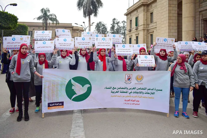 Egyptian women hold placards during a protest to show solidarity with displaced women in Arab countries, at Cairo University, marking the Arab women's day in the Egyptian capital Cairo on Feb. 01, 2017. Photo by Amr Saye...
