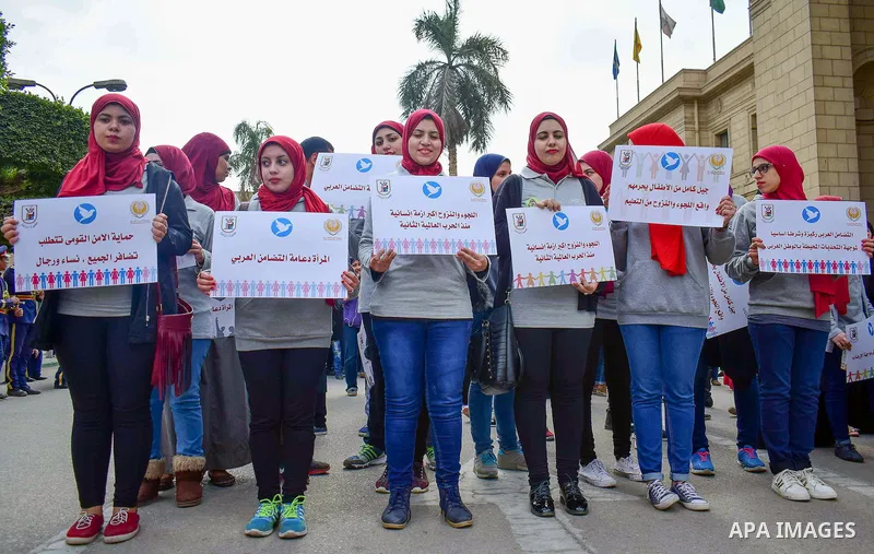 Egyptian women hold placards during a protest to show solidarity with displaced women in Arab countries, at Cairo University, marking the Arab women's day in the Egyptian capital Cairo on Feb. 01, 2017. Photo by Amr Saye...