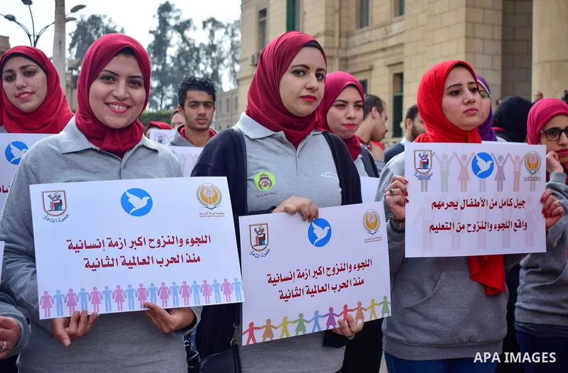 Egyptian women hold placards during a protest to show solidarity with displaced women in Arab countries, at Cairo University, marking the Arab women's day in the Egyptian capital Cairo on Feb. 01, 2017. Photo by Amr Saye...
