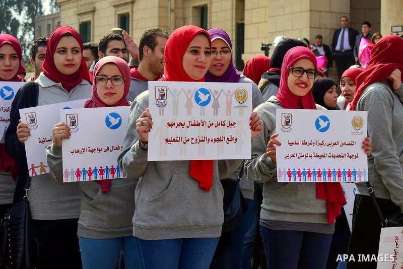 Egyptian women hold placards during a protest to show solidarity with displaced women in Arab countries, at Cairo University, marking the Arab women's day in the Egyptian capital Cairo on Feb. 01, 2017. Photo by Amr Saye...