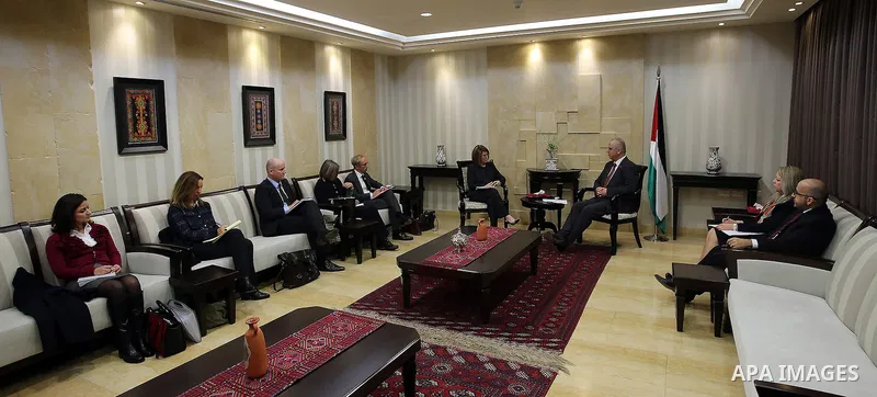 Palestinian Prime Minister Rami Hamdallah meets a delegation from the International Monetary Fund, in the West Bank city of Ramallah, on February 2, 2017. Photo by Prime Minister Office