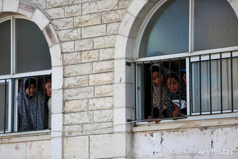 Relatives of Mohammad Zeidan, 16, a Palestinian youth who was killed by Israeli security forces on Nov. 25 after allegedly attempting to carry out a stabbing attack mourn during his funeral in the West Bank village of Bi...
