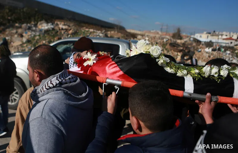 Mourners carry the body of Mohammad Zeidan, 16, a PMourners carry the body of Mohammad Zeidan, 16, a Palestinian youth who was killed by Israeli security forces on Nov. 25 after allegedly attempting to carry out a stabbi...