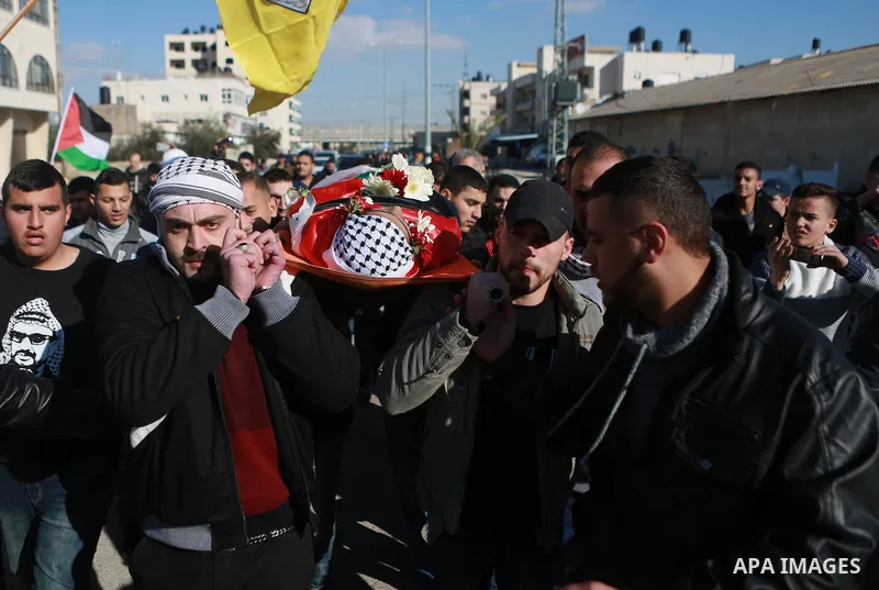 Mourners carry the body of Mohammad Zeidan, 16, a PMourners carry the body of Mohammad Zeidan, 16, a Palestinian youth who was killed by Israeli security forces on Nov. 25 after allegedly attempting to carry out a stabbi...