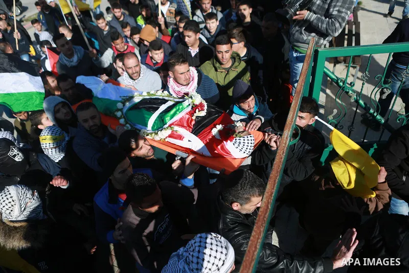 Mourners carry the body of Mohammad Zeidan, 16, a PMourners carry the body of Mohammad Zeidan, 16, a Palestinian youth who was killed by Israeli security forces on Nov. 25 after allegedly attempting to carry out a stabbi...