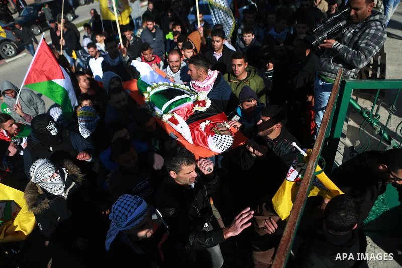 Mourners carry the body of Mohammad Zeidan, 16, a PMourners carry the body of Mohammad Zeidan, 16, a Palestinian youth who was killed by Israeli security forces on Nov. 25 after allegedly attempting to carry out a stabbi...