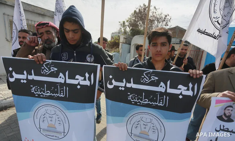 Palestinians hold placards during a protest to show solidarity with Palestinian prisoners held in Israeli Jails, in Gaza city, on February 4, 2017. Photo by Mohammed Asad