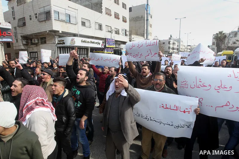 Palestinian protesters take part in a demonstration organised by Hizb el-Tahrir against what they say is a decision by Palestinian Authority granting an Islamic land to a Russian church in the West Bank city of Hebron Fe...