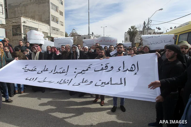 Palestinian protesters take part in a demonstration organised by Hizb el-Tahrir against what they say is a decision by Palestinian Authority granting an Islamic land to a Russian church in the West Bank city of Hebron Fe...