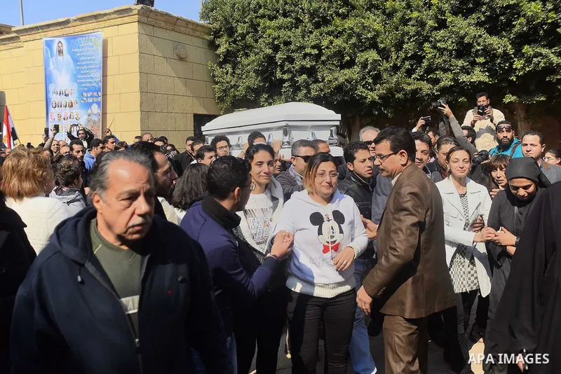 Egyptian Christians mourn during the funeral of Demiana Amir, 14, who was died last night after she was wounded at a bomb explosion that targeted the Saint Peter and Saint Paul Coptic Orthodox Church in December 2016 in...