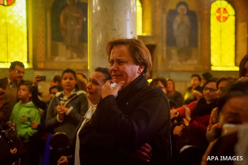 Egyptian Christians mourn during the funeral of Demiana Amir, 14, who was died last night after she was wounded at a bomb explosion that targeted the Saint Peter and Saint Paul Coptic Orthodox Church in December 2016 in...