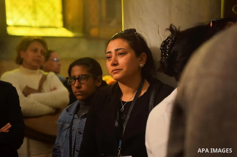 Egyptian Christians mourn during the funeral of Demiana Amir, 14, who was died last night after she was wounded at a bomb explosion that targeted the Saint Peter and Saint Paul Coptic Orthodox Church in December 2016 in...