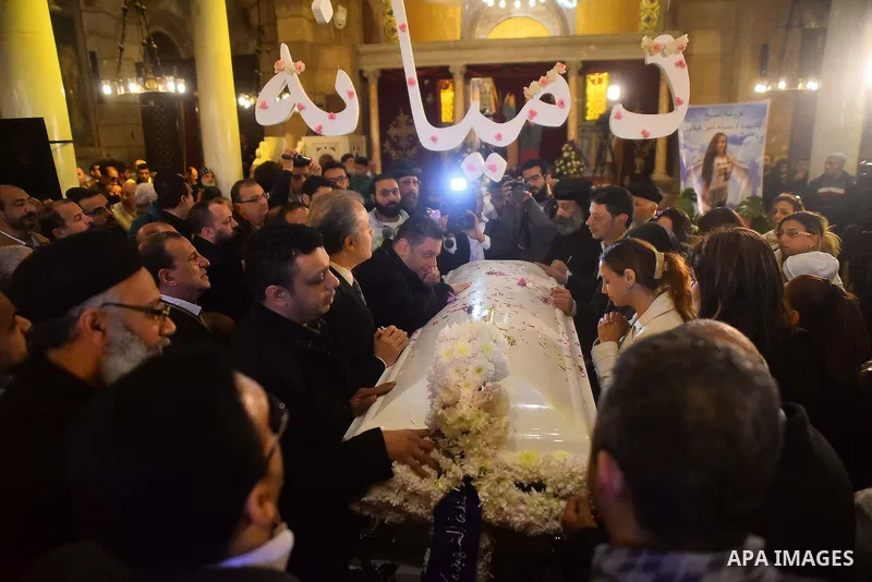 Egyptian Christians mourn during the funeral of Demiana Amir, 14, who was died last night after she was wounded at a bomb explosion that targeted the Saint Peter and Saint Paul Coptic Orthodox Church in December 2016 in...