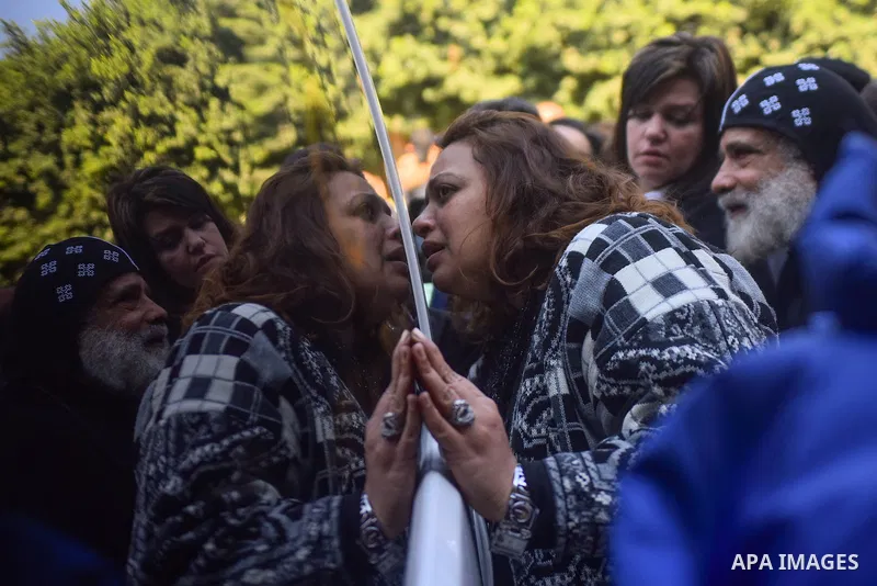 Egyptian Christians mourn during the funeral of Demiana Amir, 14, who was died last night after she was wounded at a bomb explosion that targeted the Saint Peter and Saint Paul Coptic Orthodox Church in December 2016 in...