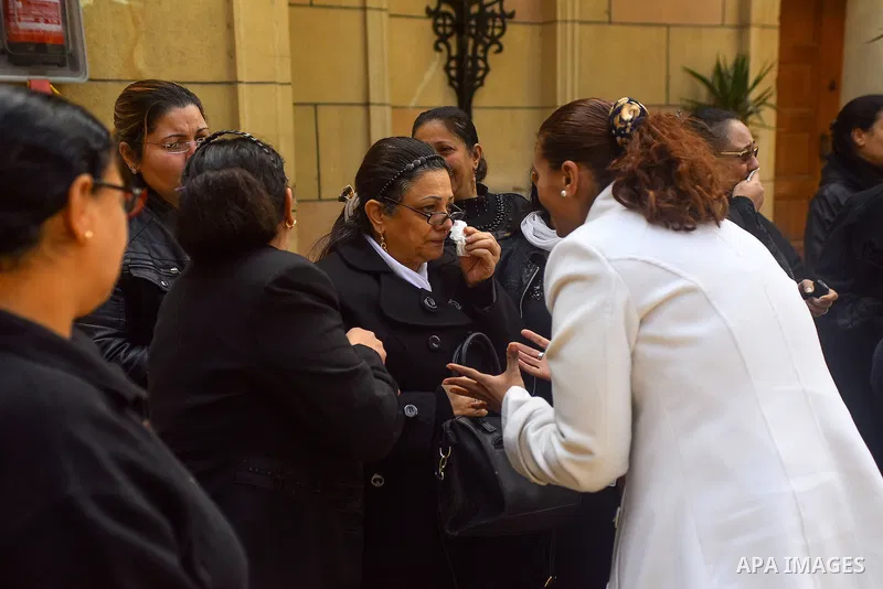Egyptian Christians mourn during the funeral of Demiana Amir, 14, who was died last night after she was wounded at a bomb explosion that targeted the Saint Peter and Saint Paul Coptic Orthodox Church in December 2016 in...