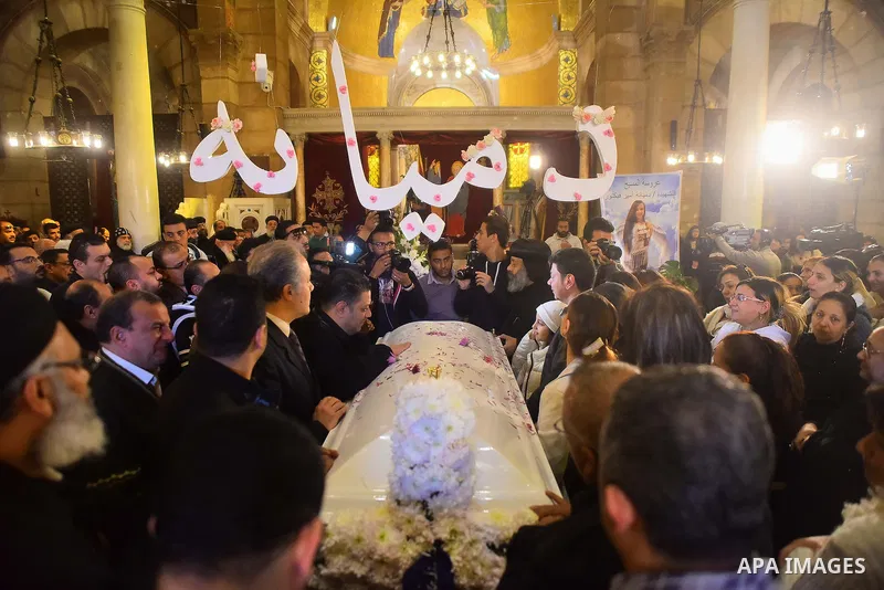 Egyptian Christians mourn during the funeral of Demiana Amir, 14, who was died last night after she was wounded at a bomb explosion that targeted the Saint Peter and Saint Paul Coptic Orthodox Church in December 2016 in...