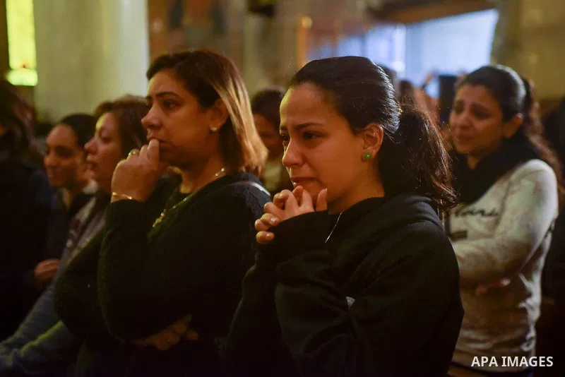 Egyptian Christians mourn during the funeral of Demiana Amir, 14, who was died last night after she was wounded at a bomb explosion that targeted the Saint Peter and Saint Paul Coptic Orthodox Church in December 2016 in...