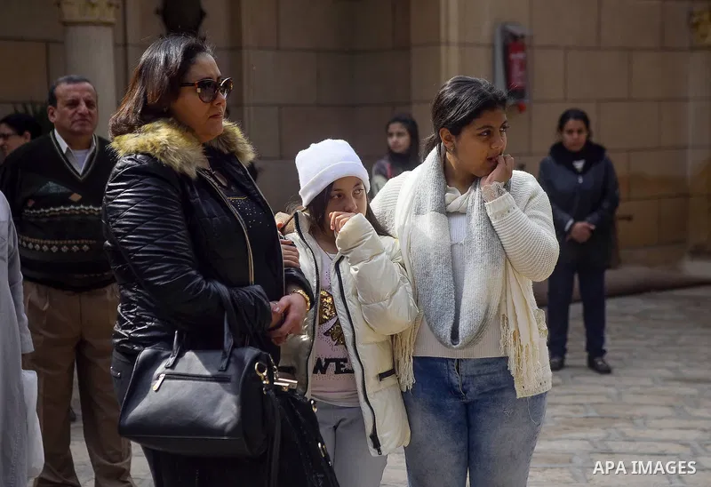 Egyptian Christians mourn during the funeral of Demiana Amir, 14, who was died last night after she was wounded at a bomb explosion that targeted the Saint Peter and Saint Paul Coptic Orthodox Church in December 2016 in...