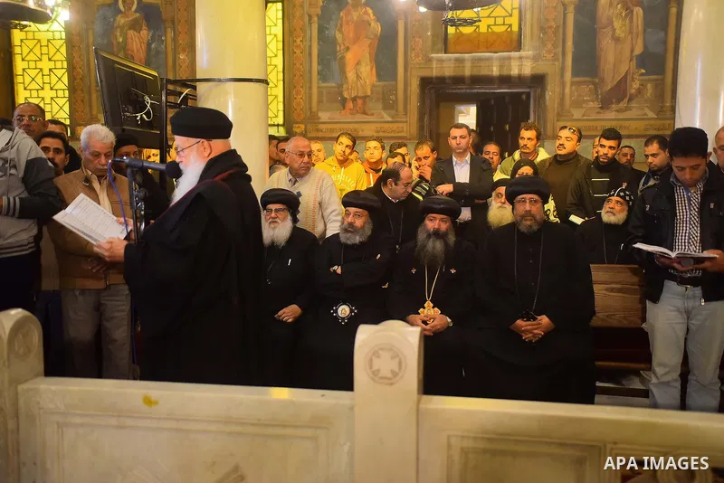 Egyptian Christians mourn during the funeral of Demiana Amir, 14, who was died last night after she was wounded at a bomb explosion that targeted the Saint Peter and Saint Paul Coptic Orthodox Church in December 2016 in...