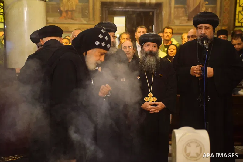 Egyptian Christians mourn during the funeral of Demiana Amir, 14, who was died last night after she was wounded at a bomb explosion that targeted the Saint Peter and Saint Paul Coptic Orthodox Church in December 2016 in...