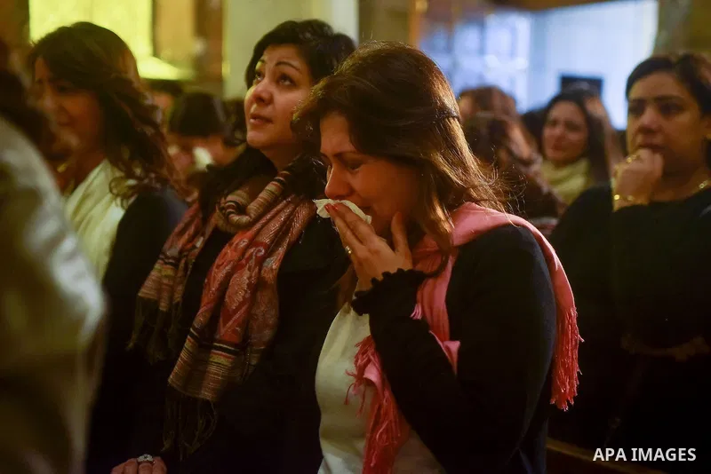 Egyptian Christians mourn during the funeral of Demiana Amir, 14, who was died last night after she was wounded at a bomb explosion that targeted the Saint Peter and Saint Paul Coptic Orthodox Church in December 2016 in...