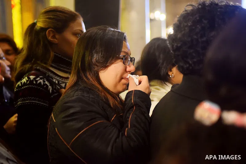 Egyptian Christians mourn during the funeral of Demiana Amir, 14, who was died last night after she was wounded at a bomb explosion that targeted the Saint Peter and Saint Paul Coptic Orthodox Church in December 2016 in...
