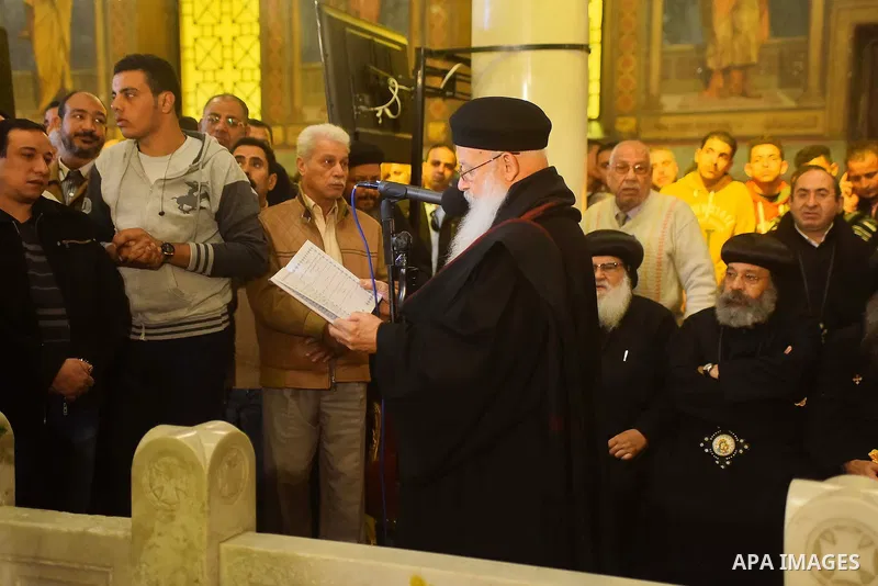 Egyptian Christians mourn during the funeral of Demiana Amir, 14, who was died last night after she was wounded at a bomb explosion that targeted the Saint Peter and Saint Paul Coptic Orthodox Church in December 2016 in...
