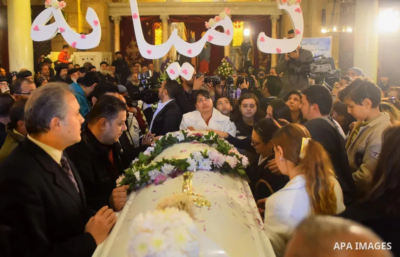 Egyptian Christians mourn during the funeral of Demiana Amir, 14, who was died last night after she was wounded at a bomb explosion that targeted the Saint Peter and Saint Paul Coptic Orthodox Church in December 2016 in...