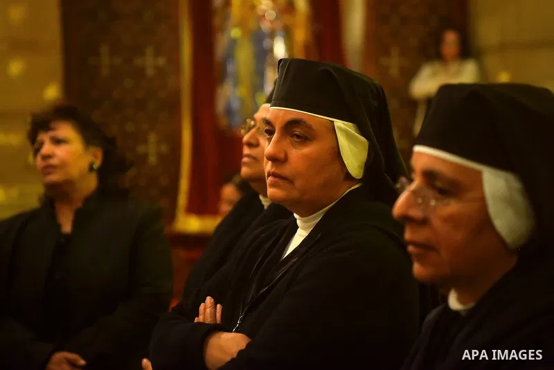 Egyptian Christians mourn during the funeral of Demiana Amir, 14, who was died last night after she was wounded at a bomb explosion that targeted the Saint Peter and Saint Paul Coptic Orthodox Church in December 2016 in...