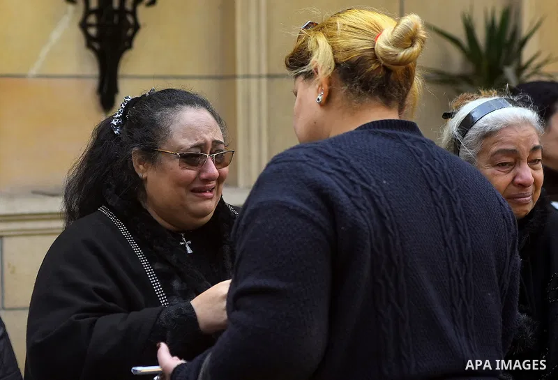 Egyptian Christians mourn during the funeral of Demiana Amir, 14, who was died last night after she was wounded at a bomb explosion that targeted the Saint Peter and Saint Paul Coptic Orthodox Church in December 2016 in...
