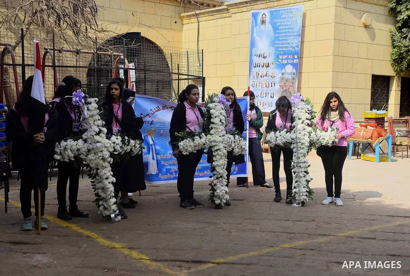 Egyptian Christians mourn during the funeral of Demiana Amir, 14, who was died last night after she was wounded at a bomb explosion that targeted the Saint Peter and Saint Paul Coptic Orthodox Church in December 2016 in...