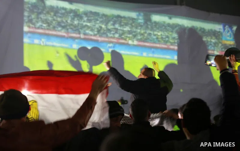 Palestinians watch on a large screen the final match of African Cup of Nations between Egypt and Cameroon, in Gaza City February 5, 2017. Photo by Mohammed Asad
