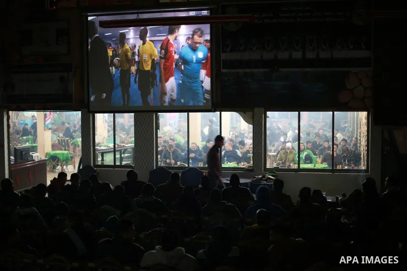 Palestinians watch on a large screen the final match of African Cup of Nations between Egypt and Cameroon, in Gaza City February 5, 2017. Photo by Mohammed Asad