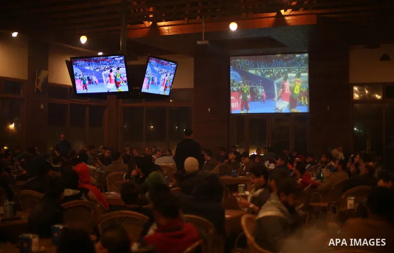 Palestinians watch on a large screen the final match of African Cup of Nations between Egypt and Cameroon, in Gaza City February 5, 2017. Photo by Mohammed Asad
