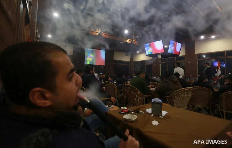 Palestinians watch on a large screen the final match of African Cup of Nations between Egypt and Cameroon, in Gaza City February 5, 2017. Photo by Mohammed Asad