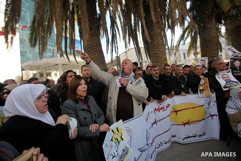 Palestinians hold placards during a protest to show solidarity with Palestinian prisoners held in Israeli Jails, in the West Bank city of Nablus, on Feb. 06, 2017. Photo by Stranger