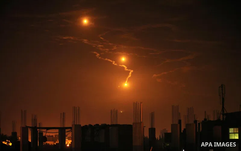 Flares fired by Israeli forces to check the border are seen over Gaza City on February 6, 2017. Israel struck a number of Hamas positions in Gaza after a "projectile" fired from the Palestinian enclave crashed in a borde...